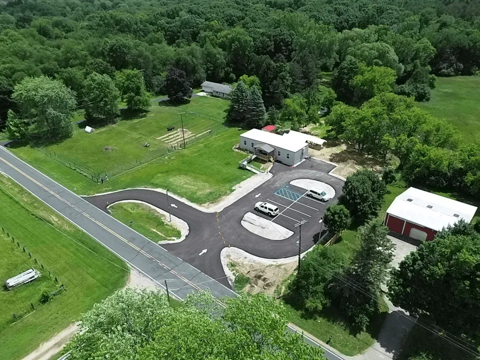 An older aerial photo of the school grounds, taken in Summer of 2025.