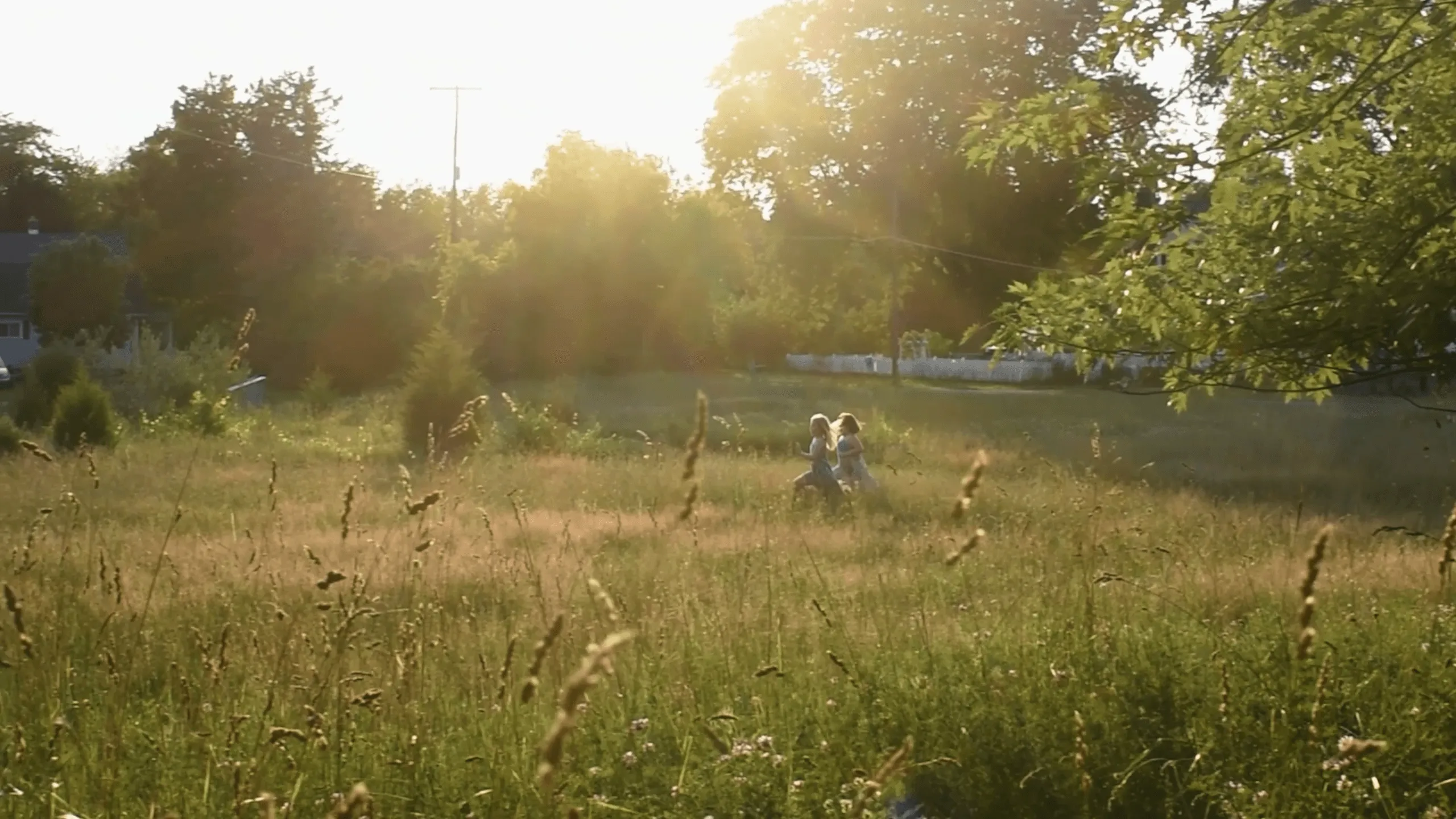 Two girls play on the school grounds