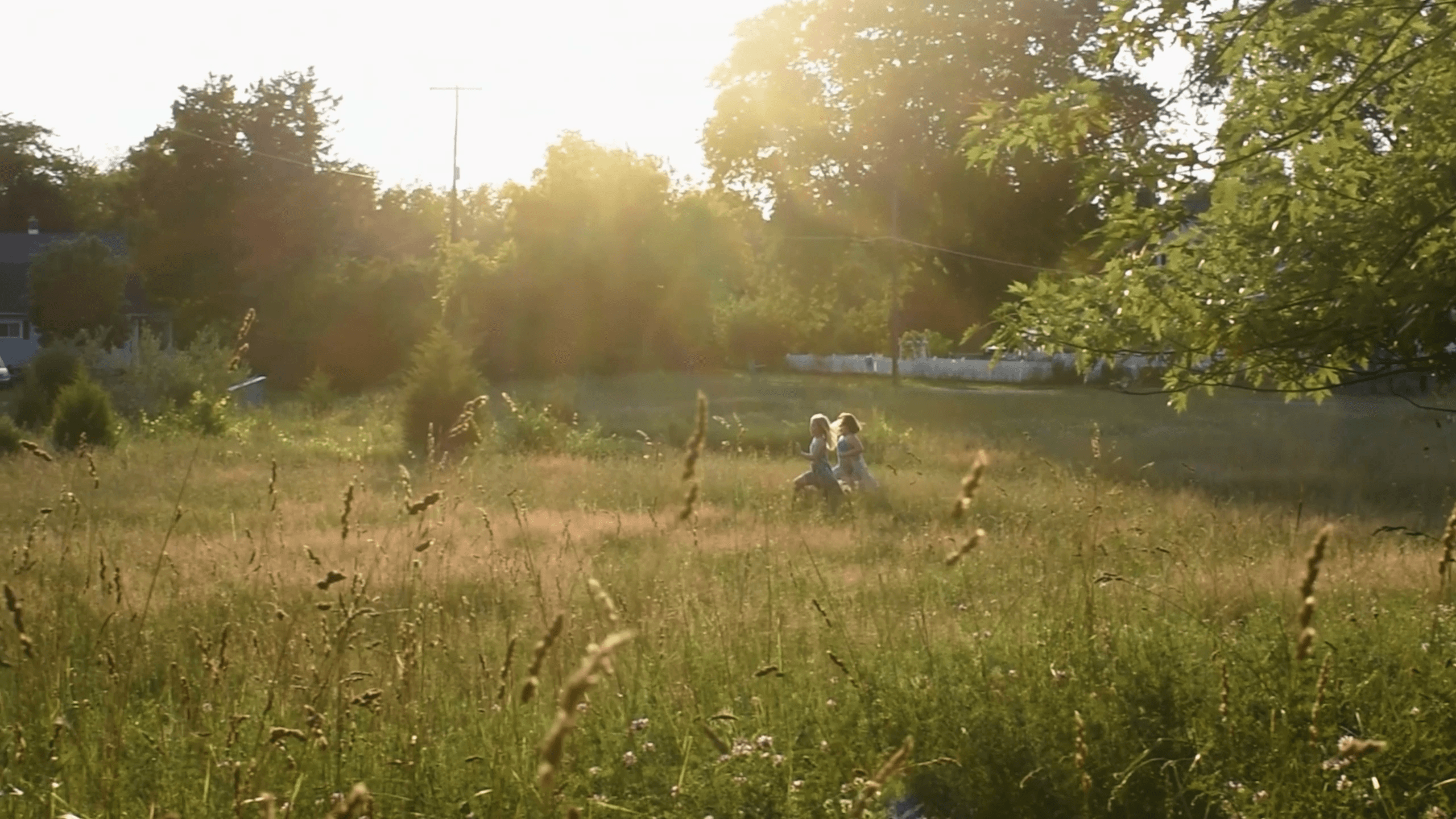 Two girls play on the school grounds